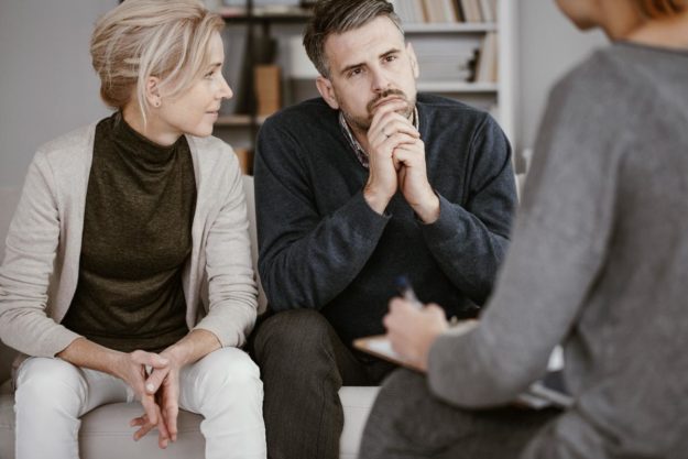 Couple in therapy talking about The 6 Types of Adversity